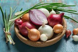 A basket brimming with fresh onions, showcasing the health benefits and culinary versatility of this nutrient-rich vegetable.