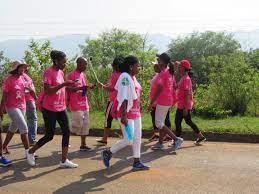 Participants walking together in a breast cancer awareness event, showing solidarity and support for the cause.