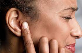 Woman Blocking Ear: Addressing Hearing Discomfort Issues