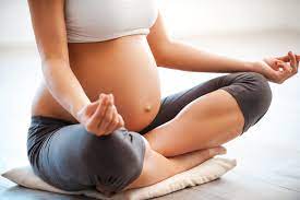 Expectant mother in seated yoga pose