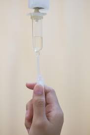 adjusting drip rate of IV medication